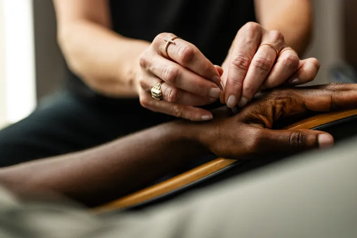 An image of a woman receiving acupuncture at the YMCA