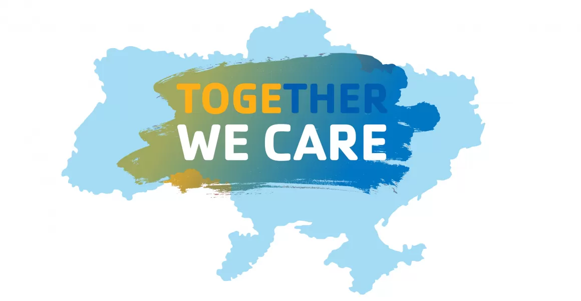 A map of Ukraine in light blue with the words &quot;TOGETHER WE CARE&quot; on top of a painted brush stroke with Ukrainian flag colors on it