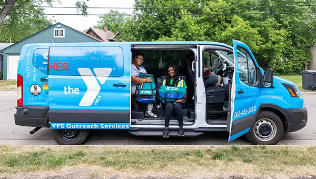 YMCA Outreach Services vehicle and staff
