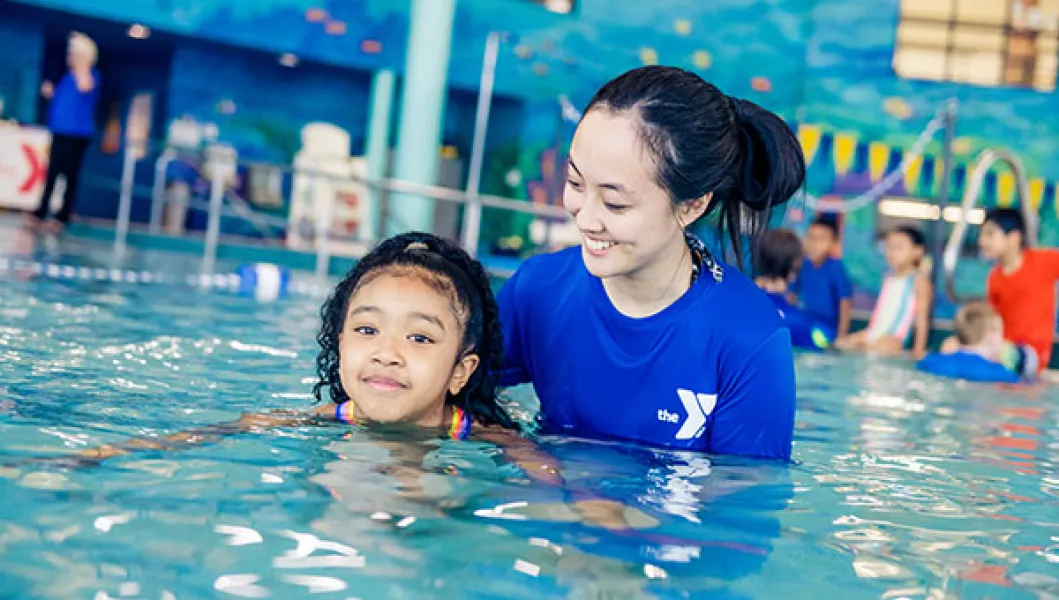 YMCA swim lesson instructor and student