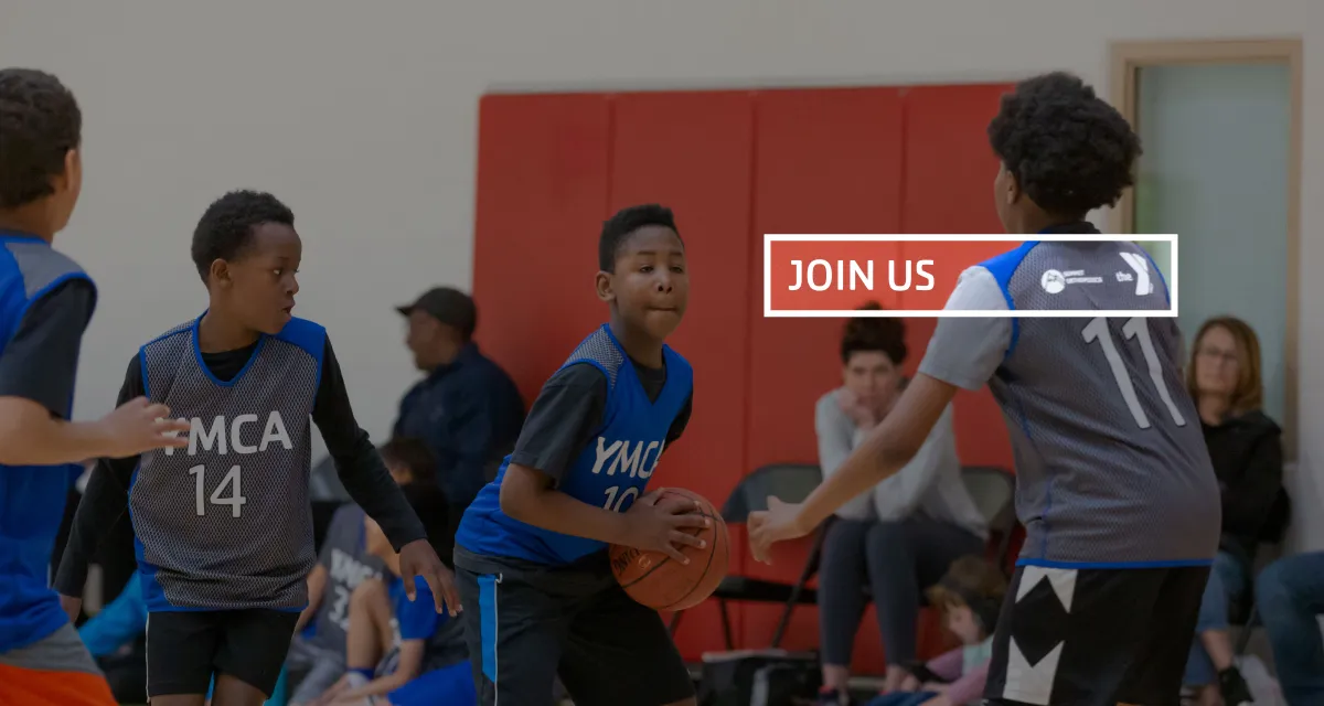 Kids playing basketball with sponsor logos highlighted.