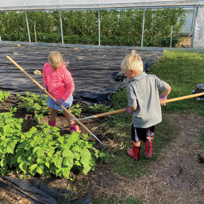 Kids working in the garden at Camp St. Croix