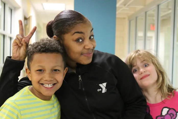 Staff member with two students