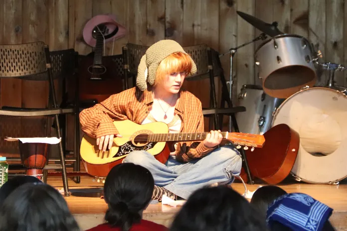 2025 Warren camper performing at the Drama and Music night.