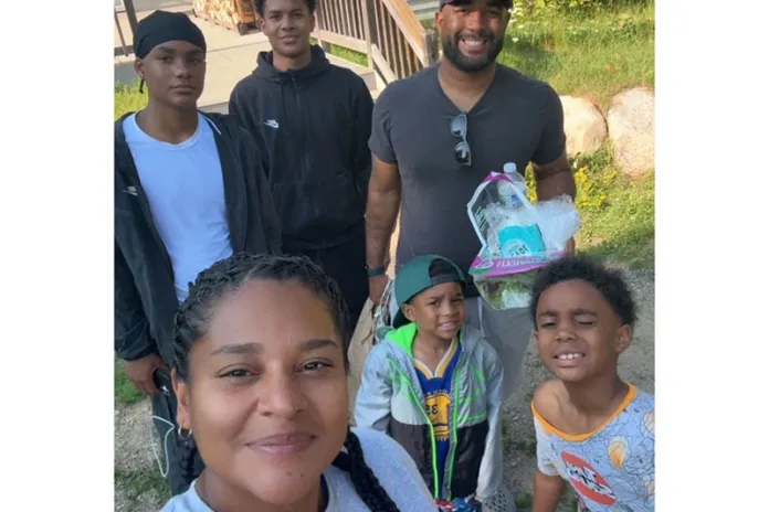 Mercedes and Mack with their children at camp in 2026