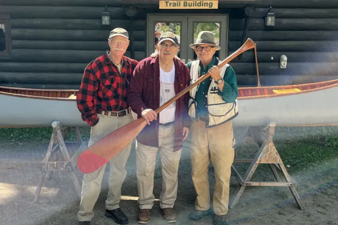 Bruce, center, with two friends and W3.