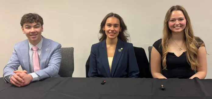 Landon, Maitreya and Mary preparing to answer questions on the panel