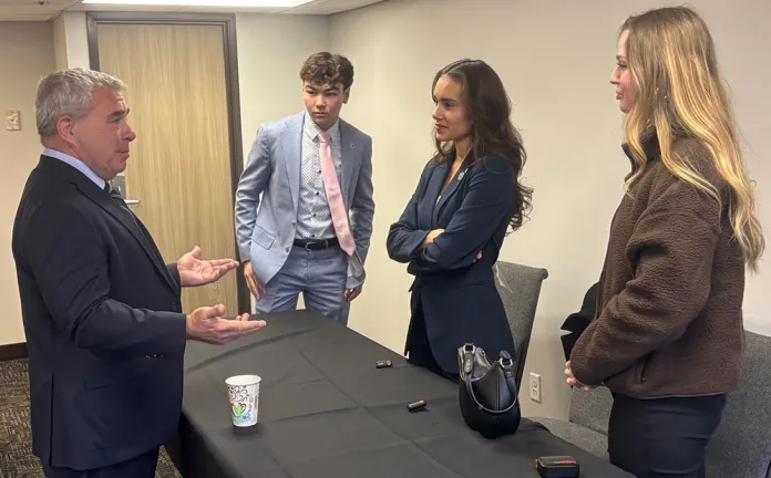 Minnesota State Senator Steve Cwodzinski speaking with the students