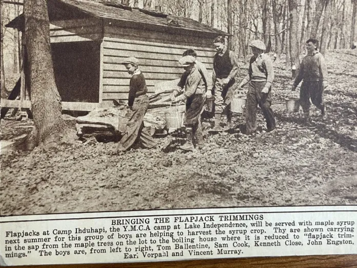 Historic photo of campers collecting sap from trees around Ihduhapi.