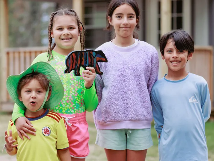 Northern Lights campers proudly show off “Bore”, found after just a few clues.