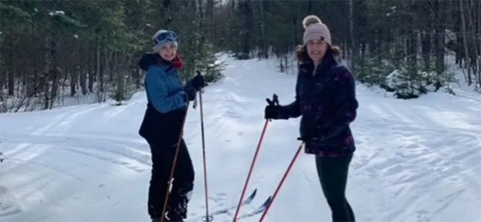 Rachel and Tiffany skiing at camp